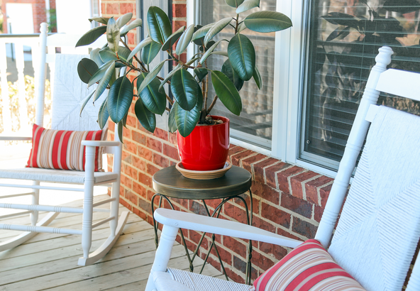 Front porch with white rocking chairs, a starter home for first-time buyers in South Jersey