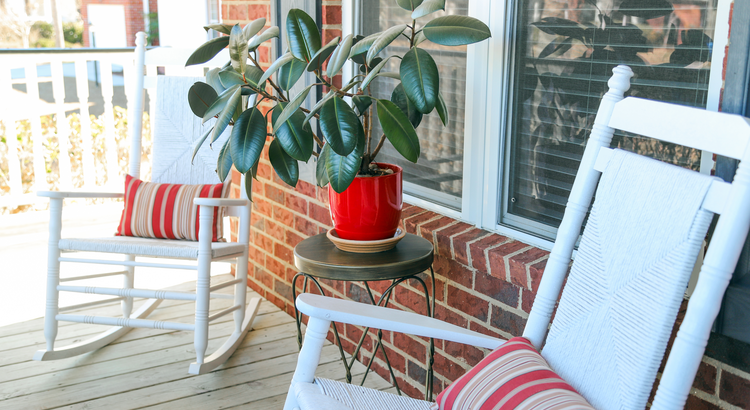Front porch with white rocking chairs, a starter home for first-time buyers in South Jersey